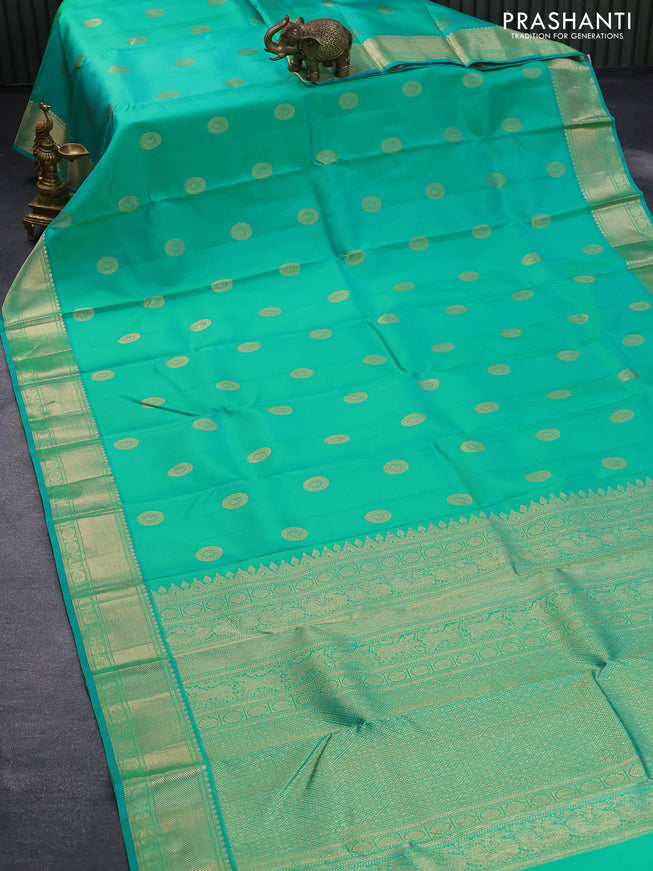 Pure kanjivaram silk saree dual shade of teal green with paisley zari woven buttas and rich zari woven border butta style