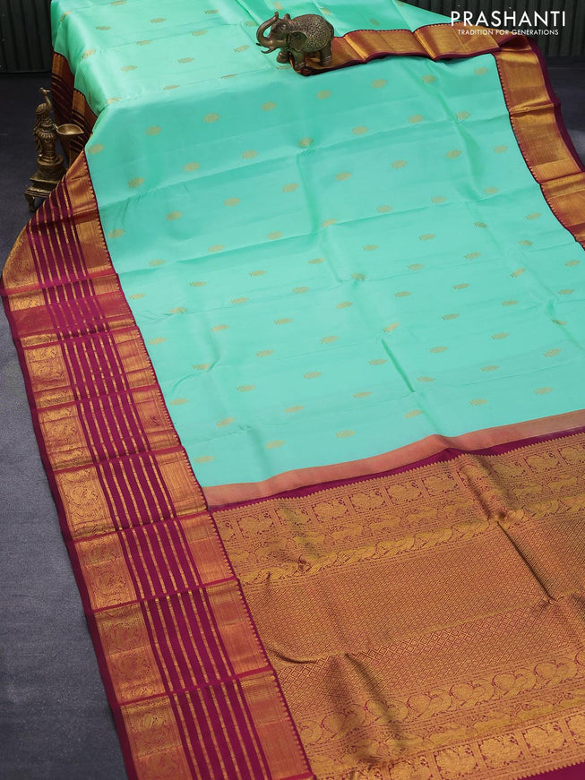 Pure kanjivaram silk saree teal green shade and dark magenta pink with allover zari woven annam buttas and long rich zari woven korvai border butta style