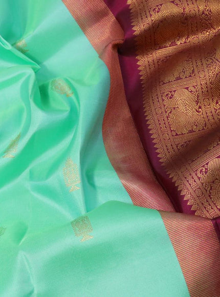 Pure kanjivaram silk saree teal green shade and dark magenta pink with allover zari woven annam buttas and long rich zari woven korvai border butta style