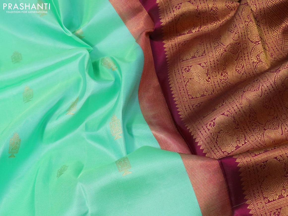 Pure kanjivaram silk saree teal green shade and dark magenta pink with allover zari woven annam buttas and long rich zari woven korvai border butta style