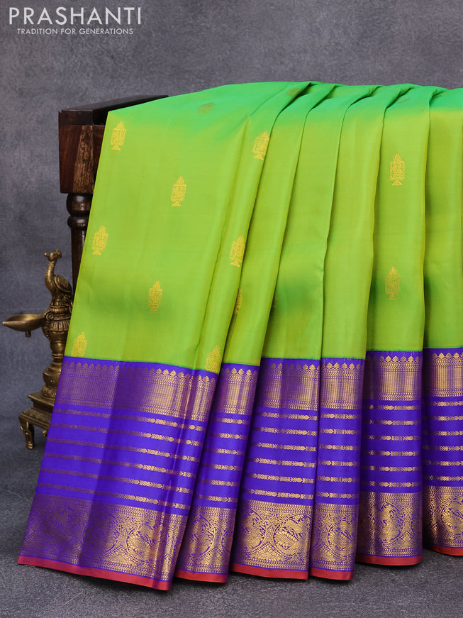 Pure kanjivaram silk saree light green and blue with allover zari woven annam buttas and long rich zari woven korvai border butta style
