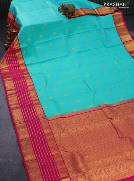 Pure kanjivaram silk saree dual shade of teal bluish green and pink with allover zari woven annam buttas and long rich zari woven korvai border butta style