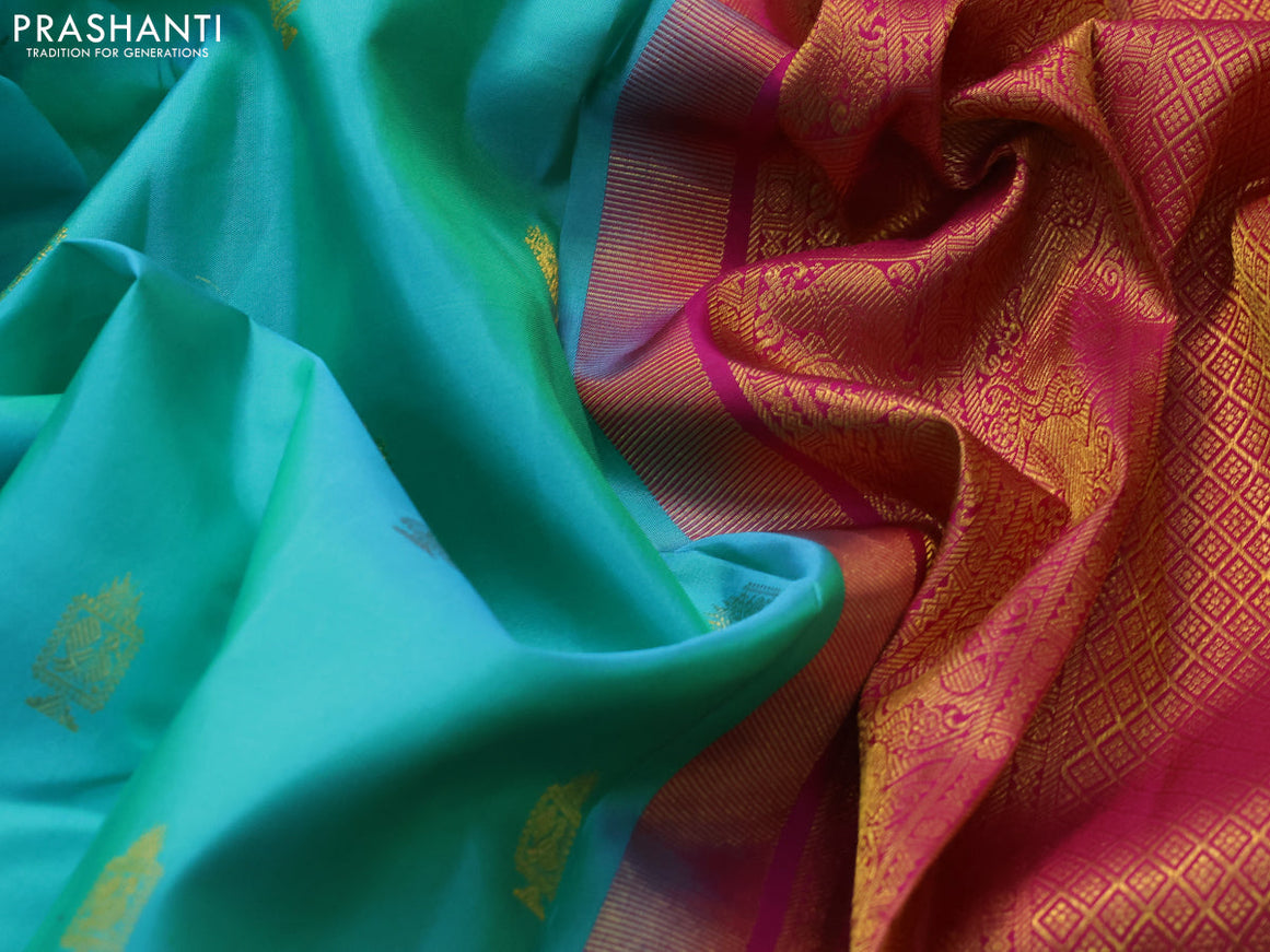 Pure kanjivaram silk saree dual shade of teal bluish green and pink with allover zari woven annam buttas and long rich zari woven korvai border butta style