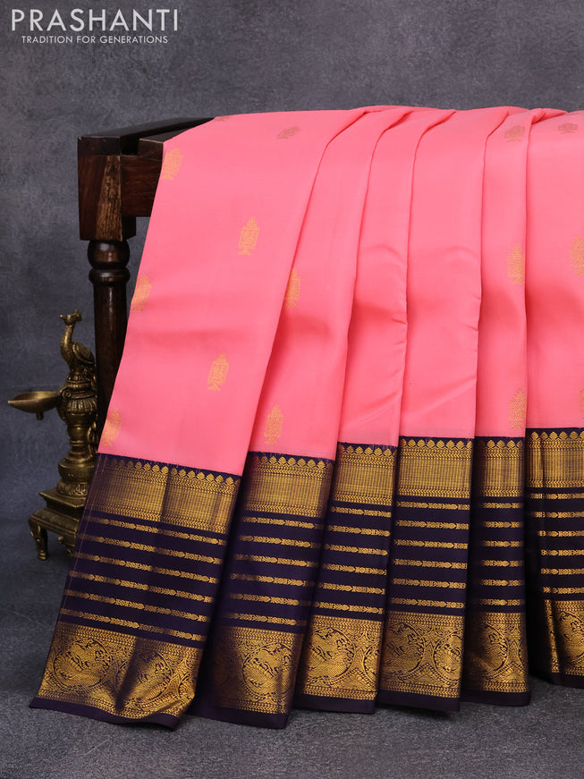 Pure kanjivaram silk saree light pink and navy blue with allover zari woven annam buttas and long rich zari woven korvai border butta style