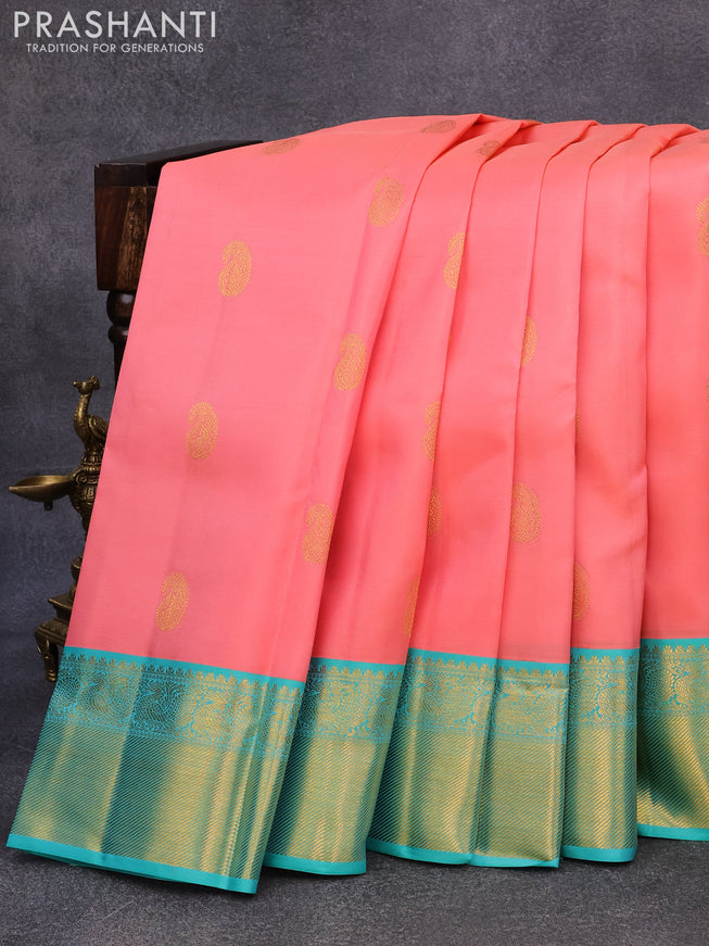 Pure kanjivaram silk saree peach pink and teal blue with paisley zari woven buttas and rich annam zari woven border butta style