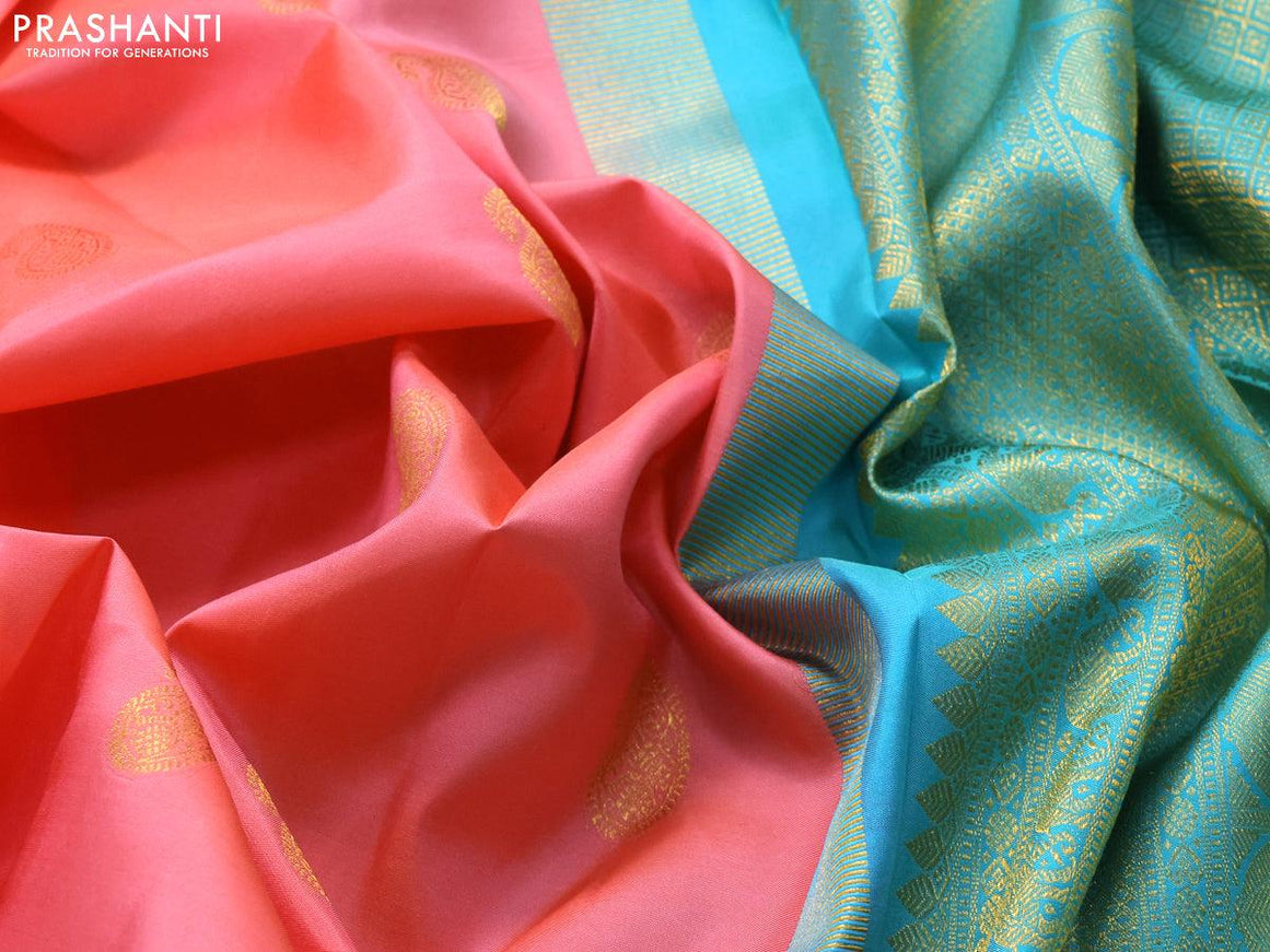 Pure kanjivaram silk saree peach pink and teal blue with paisley zari woven buttas and rich annam zari woven border butta style