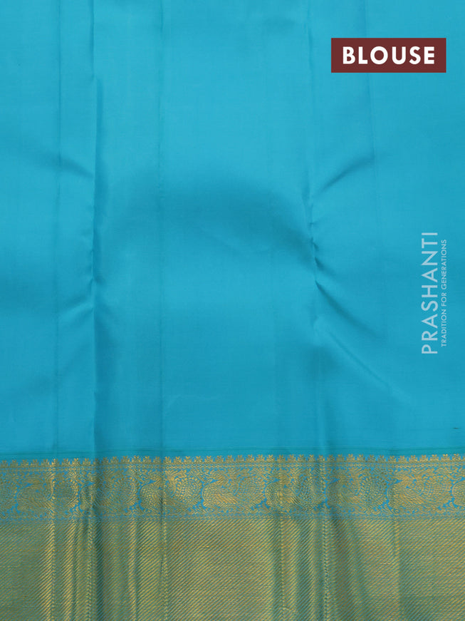 Pure kanjivaram silk saree peach pink and teal blue with paisley zari woven buttas and rich annam zari woven border butta style