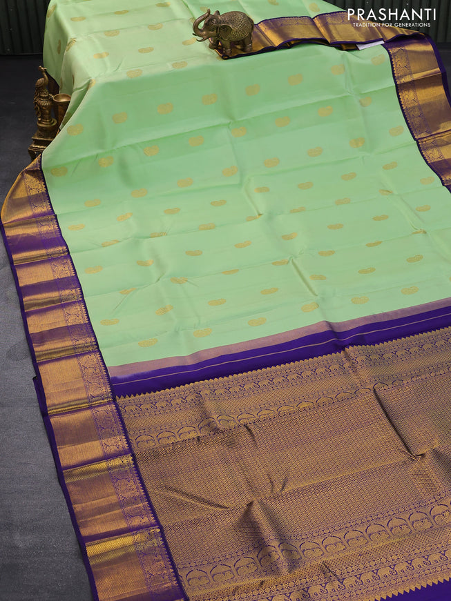 Pure kanjivaram silk saree pista green and dark blue with paisley zari woven buttas and rich annam zari woven border butta style