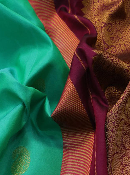 Pure kanjivaram silk saree teal green shade and dark magenta with paisley zari woven buttas and rich annam zari woven border butta style