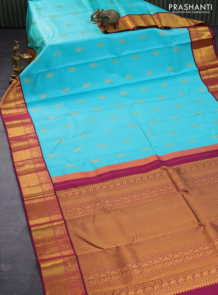 Pure kanjivaram silk saree teal blue shade and dark magenta with paisley zari woven buttas and rich annam zari woven border butta style