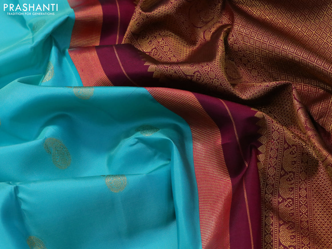 Pure kanjivaram silk saree teal blue shade and dark magenta with paisley zari woven buttas and rich annam zari woven border butta style