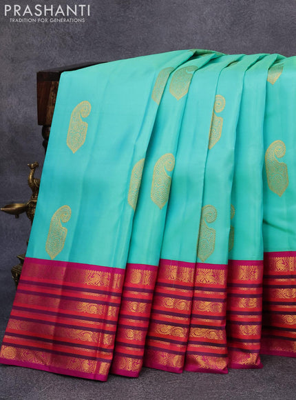 Pure kanjivaram silk saree teal blue shade and purple with paisley zari woven buttas and rich annam & rudhraksha zari woven korvai border butta style