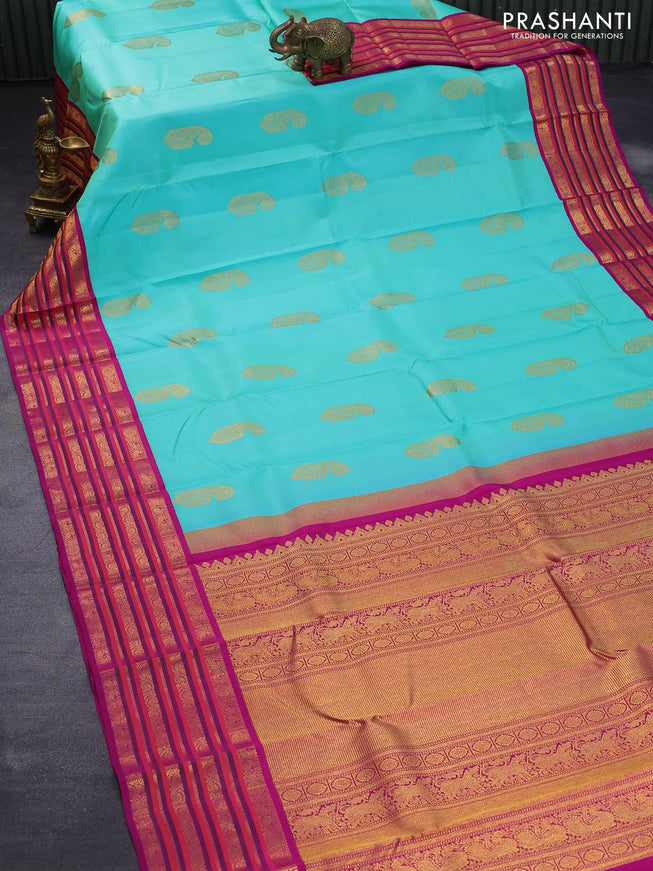 Pure kanjivaram silk saree teal blue shade and purple with paisley zari woven buttas and rich annam & rudhraksha zari woven korvai border butta style