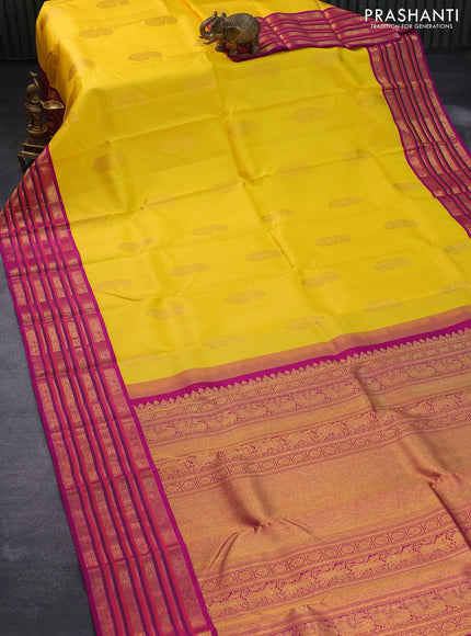 Pure kanjivaram silk saree mango yellow and purple with paisley zari woven buttas and rich annam & rudhraksha zari woven korvai border butta style