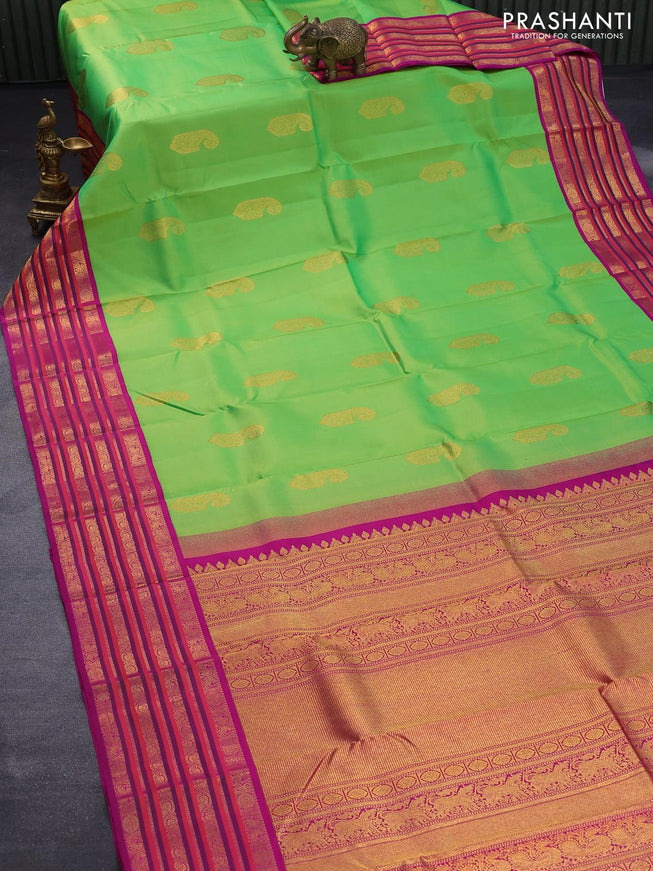 Pure kanjivaram silk saree light green and magenta pink with paisley zari woven buttas and rich annam & rudhraksha zari woven korvai border butta style