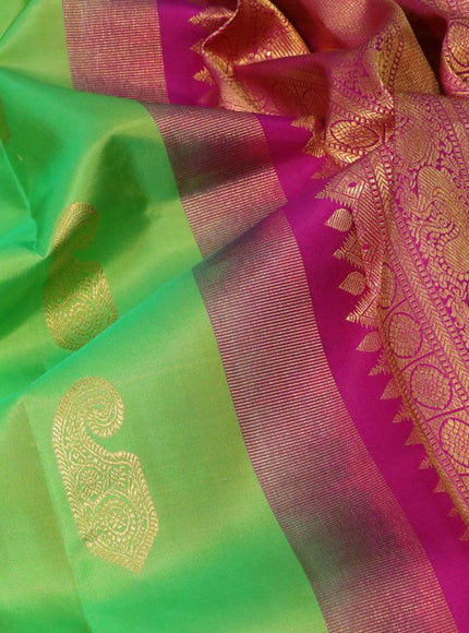 Pure kanjivaram silk saree light green and magenta pink with paisley zari woven buttas and rich annam & rudhraksha zari woven korvai border butta style