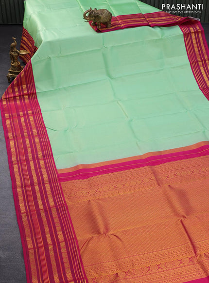 Pure kanjivaram silk saree teal green shade and pink with allover zari weaves and long rich zari woven border allover weaves