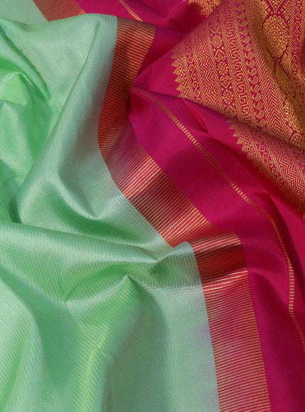 Pure kanjivaram silk saree teal green shade and pink with allover zari weaves and long rich zari woven border allover weaves