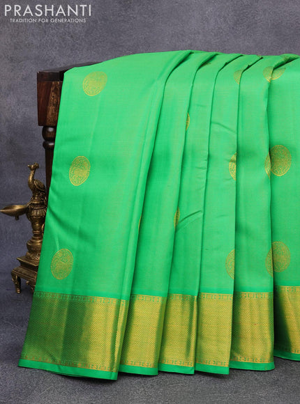 Pure kanjivaram silk saree parrot green and pink with allover zari weaves & buttas and rich zari woven border allover weaves