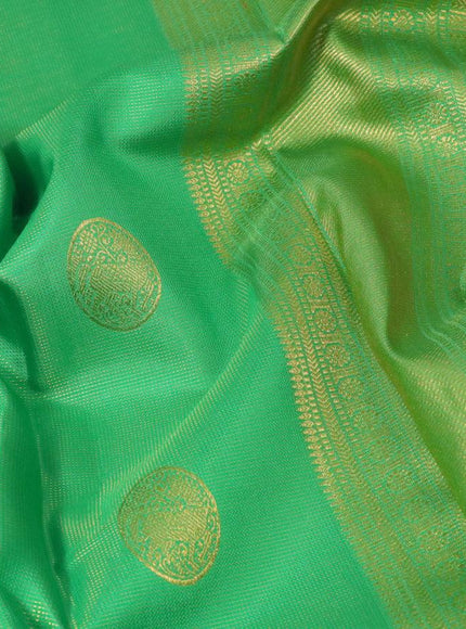 Pure kanjivaram silk saree parrot green and pink with allover zari weaves & buttas and rich zari woven border allover weaves