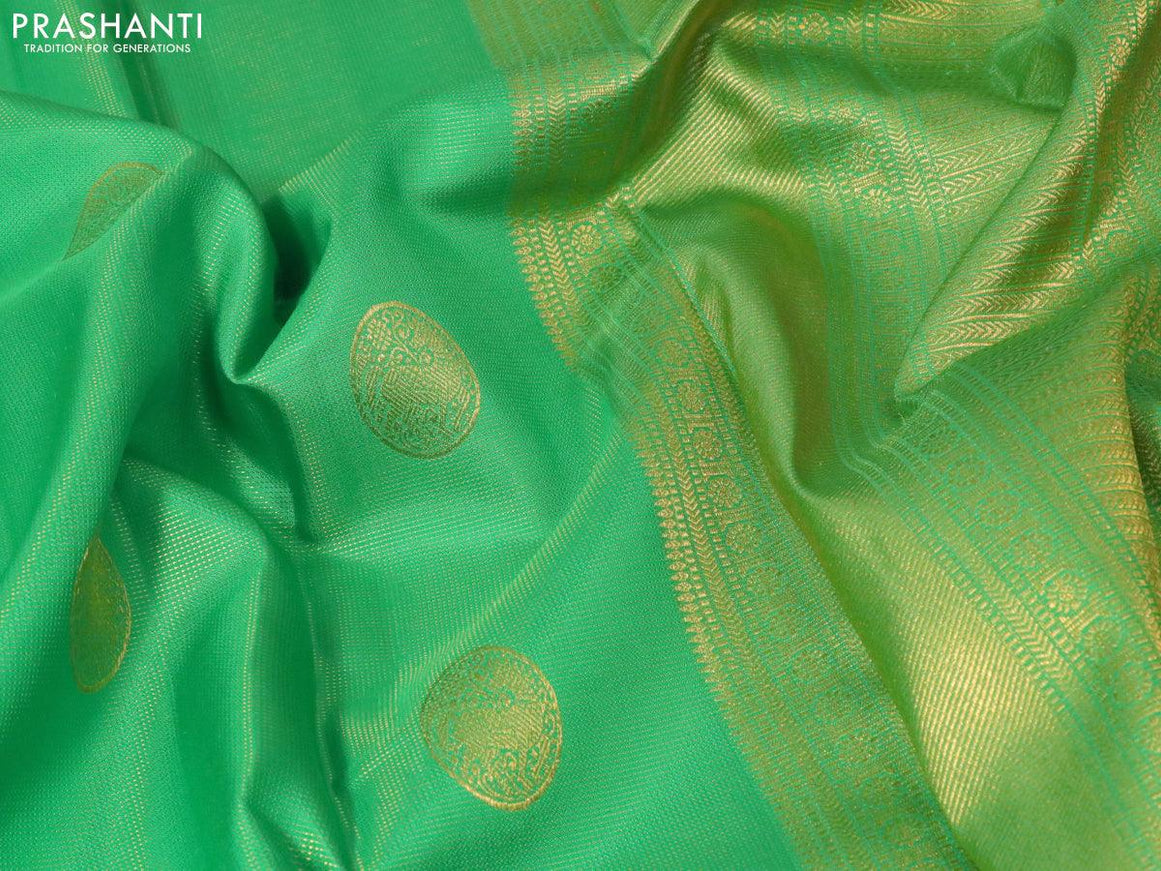 Pure kanjivaram silk saree parrot green and pink with allover zari weaves & buttas and rich zari woven border allover weaves