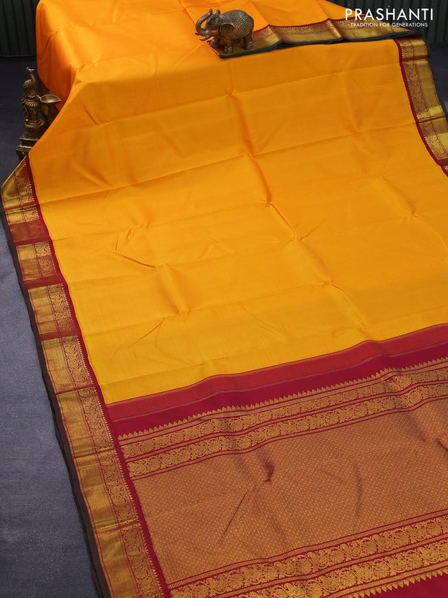 Pure kanjivaram silk saree mango yellow and maroon with plain body and rich zari woven korvai border plain body