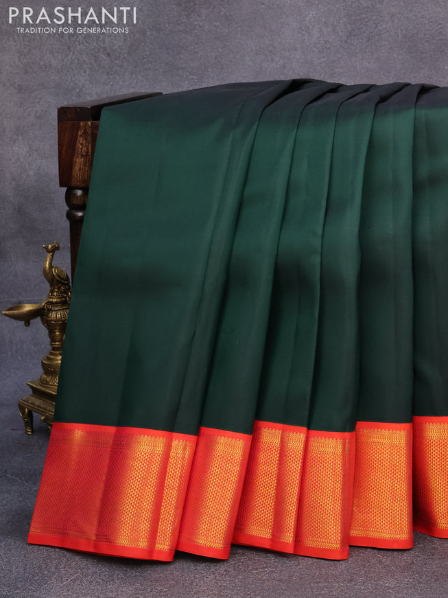 Pure kanjivaram silk saree bottle green and orange with plain body and rich zari woven border plain body