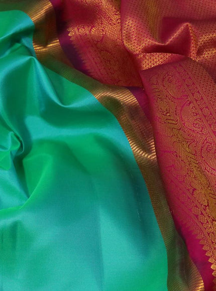 Pure kanjivaram silk saree teal green and pink with plain body and rich zari woven border plain body