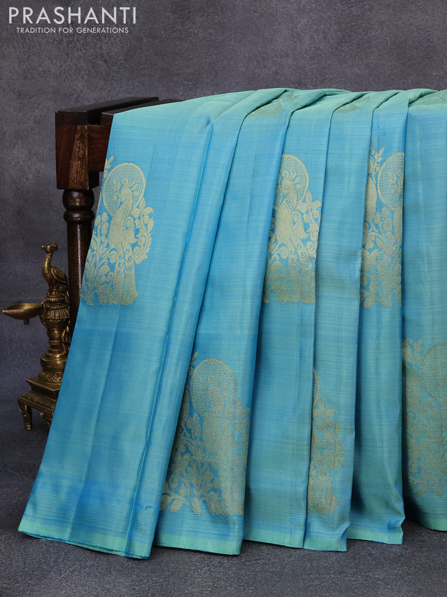 Pure kanjivaram silk saree dual shade of blue and pink with peacock zari woven buttas in borderless style borderless style
