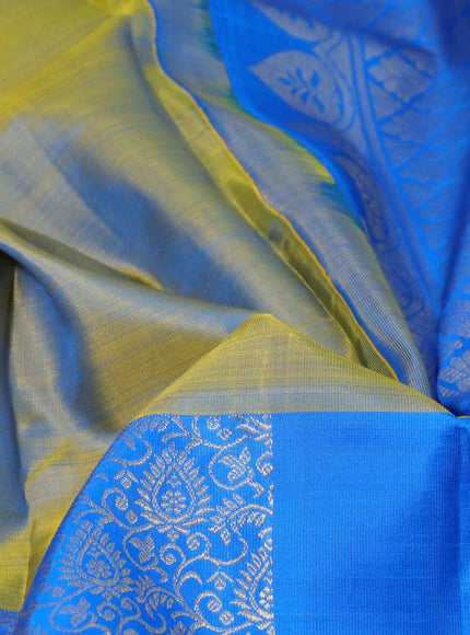 Pure kanjivaram silk saree dual shade of bluish yellow and blue with half & half style and long zari woven border half & half style