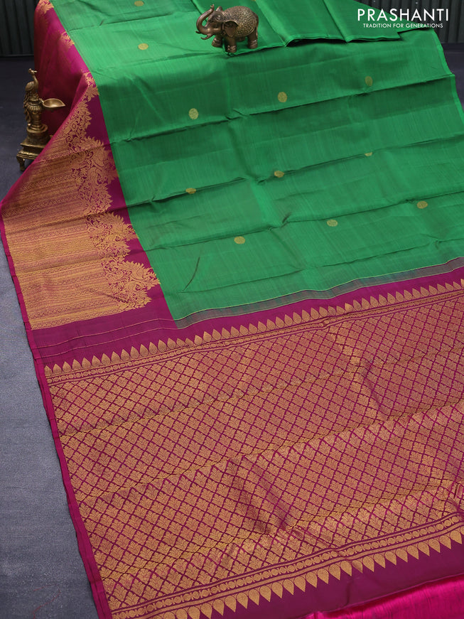 Pure kanjivaram silk saree green and magenta pink with zari woven buttas and long peacock design zari woven border butta style