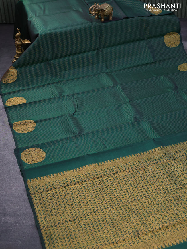 Pure kanjivaram silk saree dark green with allover zari stripe weaves and zari woven butta border allover weaves