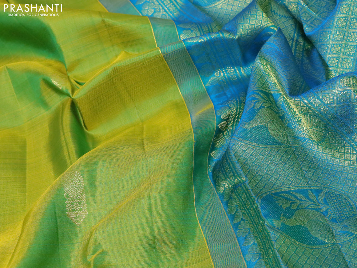 Pure kanjivaram silk saree dual shade of mustard green and dual shade of blue with zari woven buttas and long zari woven butta border butta style