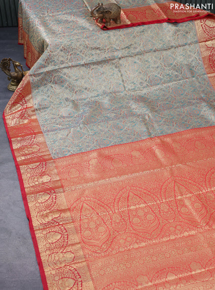 Tissue semi kanjivaram saree beige teal green and red with allover brocade weaves and zari woven border