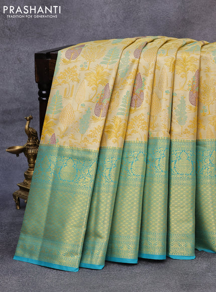 Tissue semi kanjivaram saree yellow and teal blue with allover brocade weaves and long zari woven border