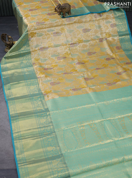 Tissue semi kanjivaram saree yellow and teal blue with allover brocade weaves and long zari woven border