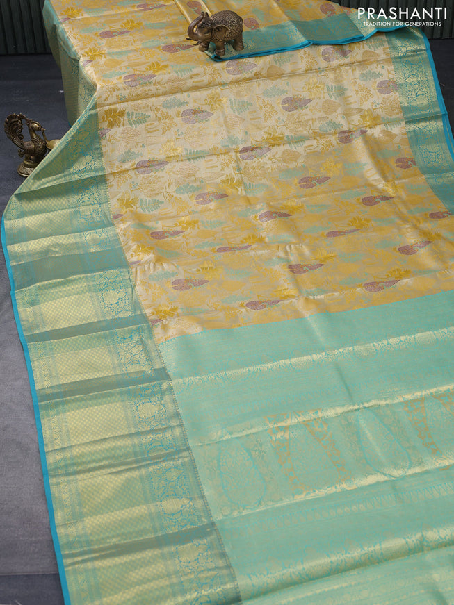 Tissue semi kanjivaram saree yellow and teal blue with allover brocade weaves and long zari woven border