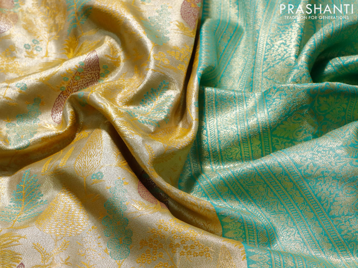 Tissue semi kanjivaram saree yellow and teal blue with allover brocade weaves and long zari woven border