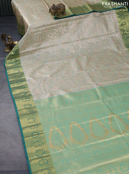 Tissue semi kanjivaram saree beige and teal blue with allover brocade weaves and zari woven border