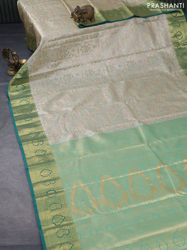 Tissue semi kanjivaram saree beige and teal blue with allover brocade weaves and zari woven border