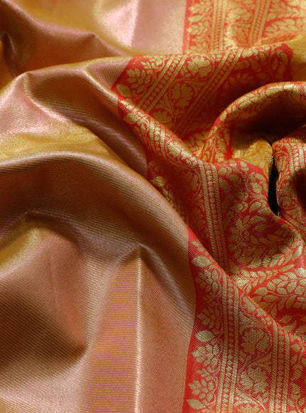 Tissue semi kanjivaram saree peach shade and red with plain body and long zari woven border