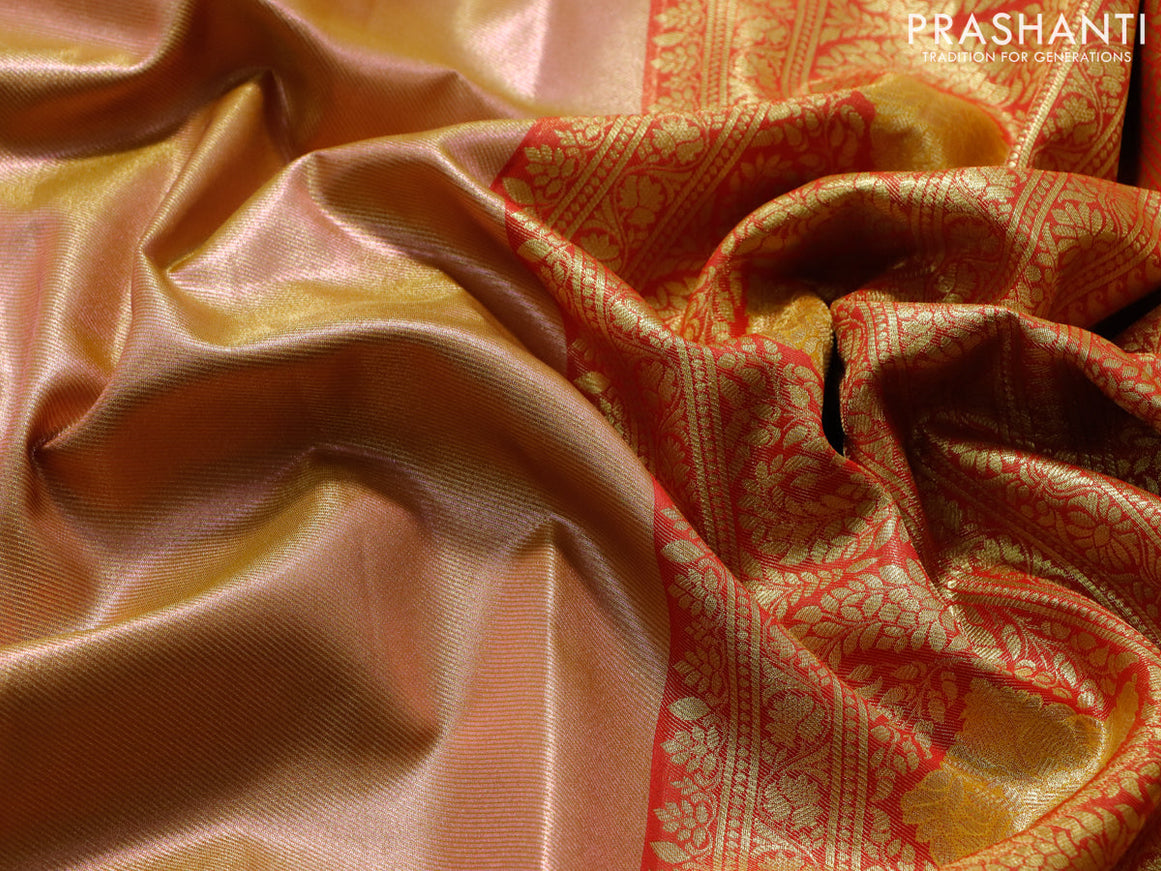 Tissue semi kanjivaram saree peach shade and red with plain body and long zari woven border