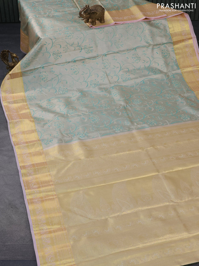 Tissue semi kanjivaram saree cream teal blue and baby pink with allover brocade weaves and zari woven border