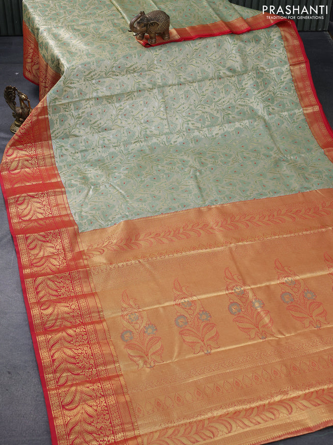 Tissue semi kanjivaram saree cream pastel green and red with allover floral brocade weaves and long zari woven border