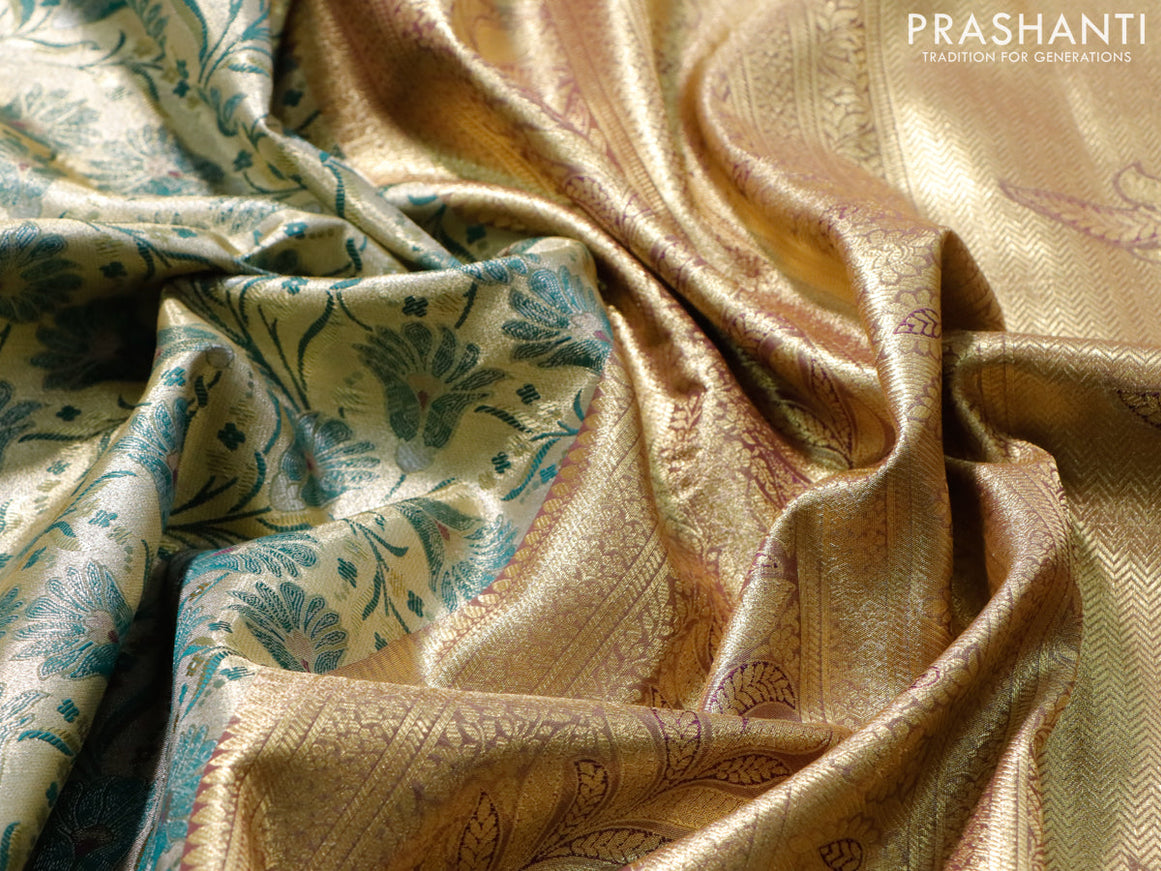 Tissue semi kanjivaram saree cream dark green and wine shade with allover floral brocade weaves and long zari woven border