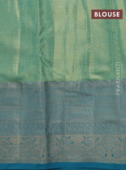 Tissue semi kanjivaram saree yellow shade and teal blue with allover floral brocade weaves and long zari woven border