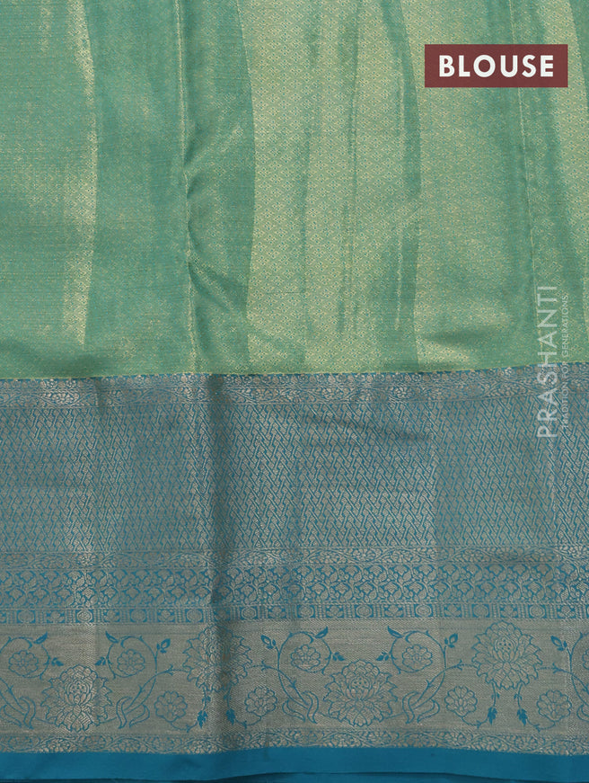 Tissue semi kanjivaram saree yellow shade and teal blue with allover floral brocade weaves and long zari woven border