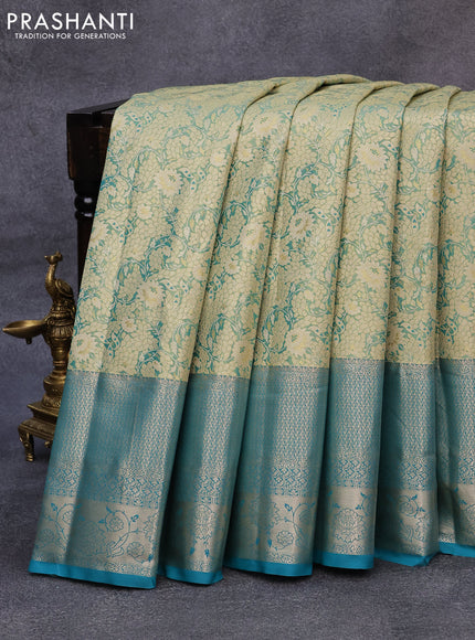 Tissue semi kanjivaram saree teal green shade and teal blue with allover floral brocade weaves and long zari woven border