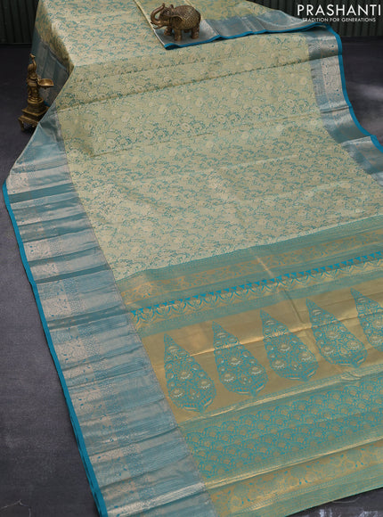 Tissue semi kanjivaram saree teal green shade and teal blue with allover floral brocade weaves and long zari woven border