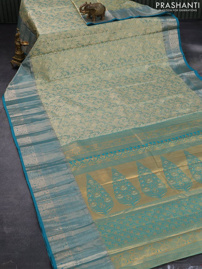 Tissue semi kanjivaram saree teal green shade and teal blue with allover floral brocade weaves and long zari woven border